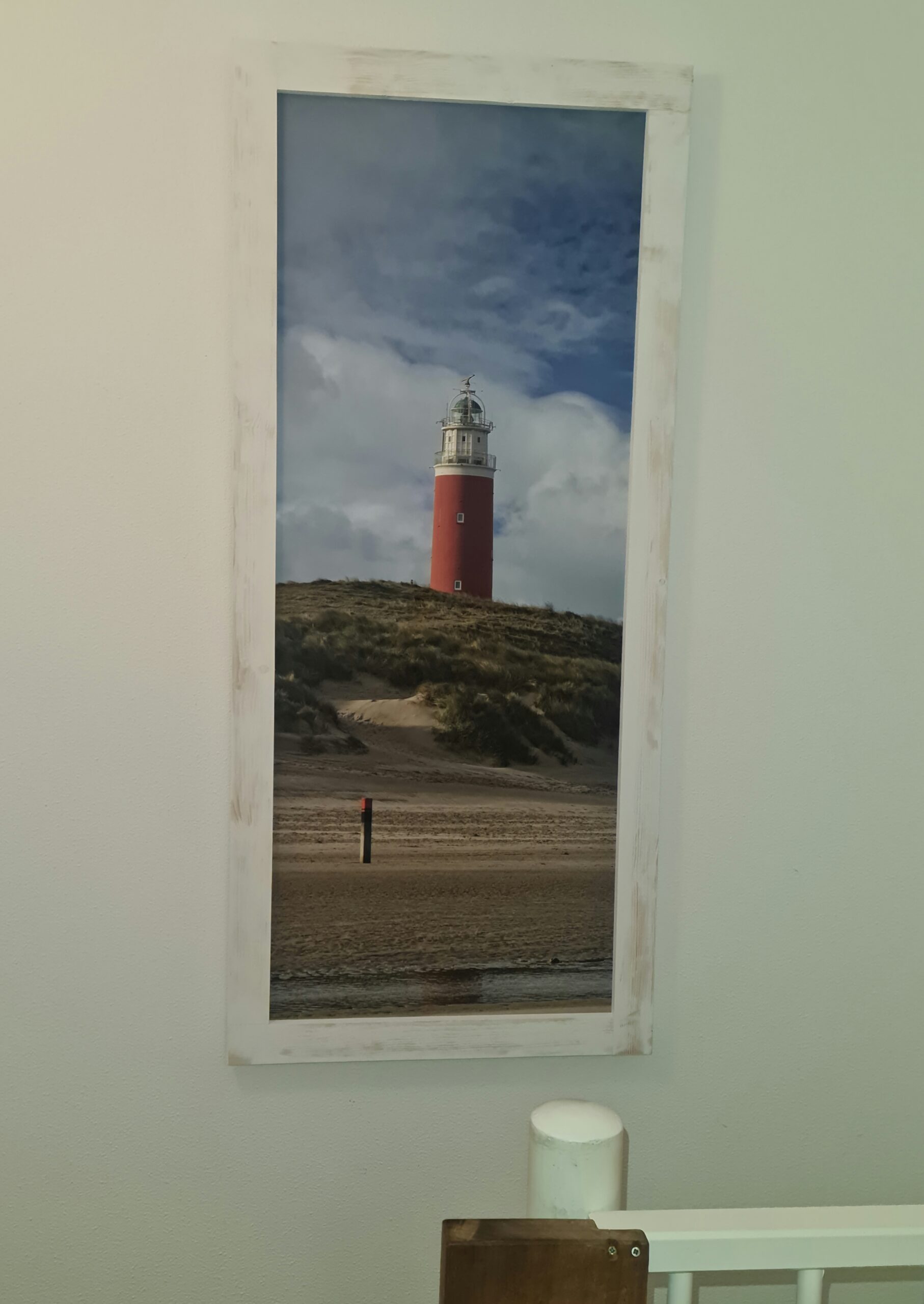 Trapgat, met schilderij van de vuurtoren van Texel.